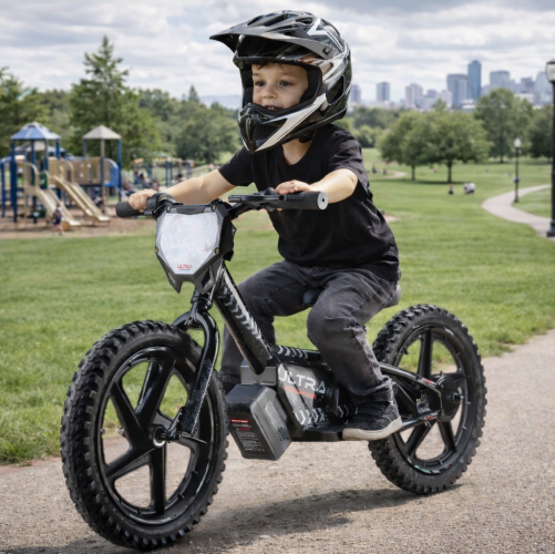 Boy riding electric balance bike in park